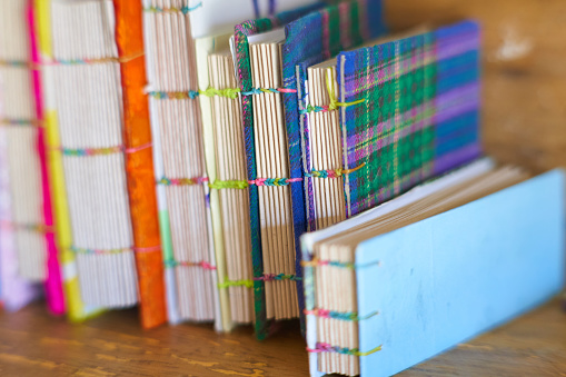 spine of notebooks with recycled materials.