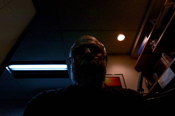 istock Mysterious Cyber Man in Dark Room 1293551425