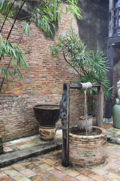 istock Outdoor antique stone artesian aquifer, underground water supply resources 1293555898