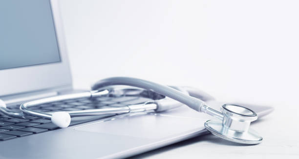 istock Stethoscope on a laptop. Virus season, pandemic. Smart working 1293560967