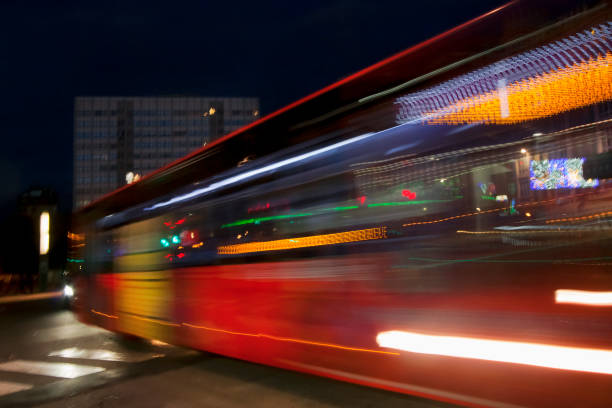 istock Moving bus  close-up view, city night life 1293561643