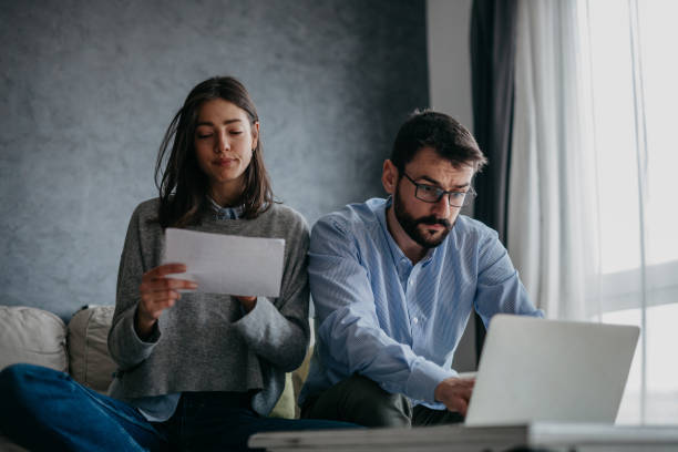 istock Focused couple doing home finances 1293563857