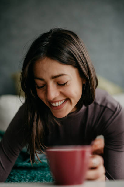 istock Female about to drink a coffee 1293564786