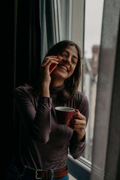 istock Conversation over phone next to the window 1293566327