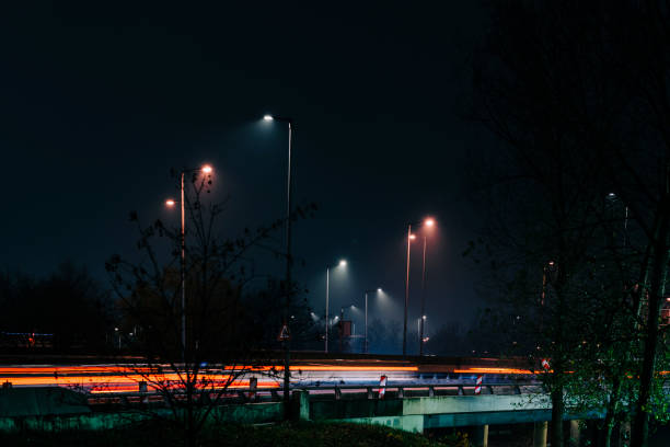 Motion blurred traffic on highway through city area