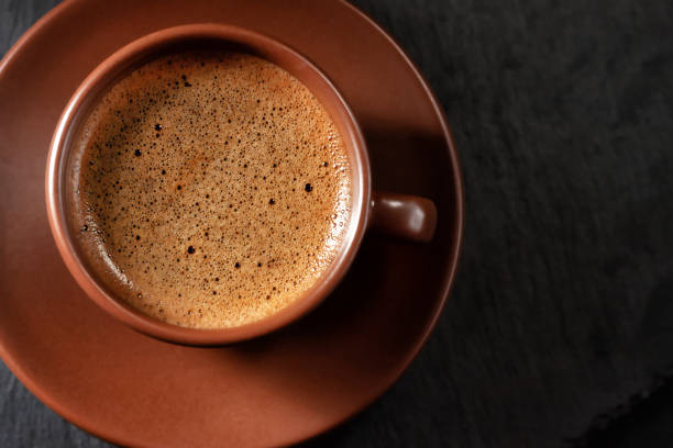 istock Coffee cup on stone background. Top view with copy space for your text 1293566636