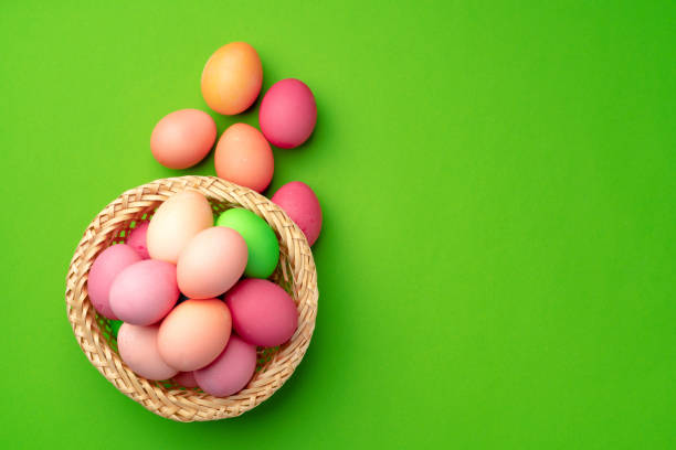 istock Easter eggs in a nest on green background 1293567697