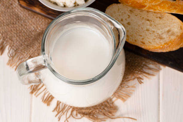 istock Milk, bread and cottage cheese on table 1293568083