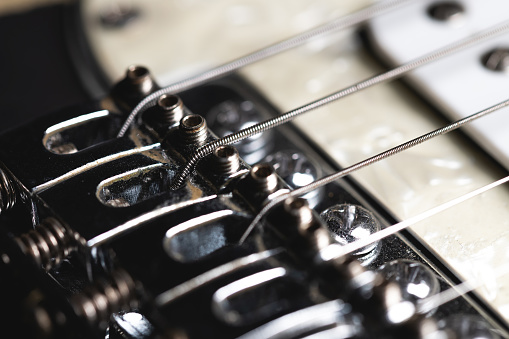Electric guitar strings close-up. Music background.