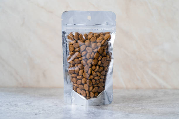 Packed Dog Food For Sale in Plastic Package Container. Packed Dog Food For Sale in Plastic Package Container. Ready to Use. dog food stock pictures, royalty-free photos & images