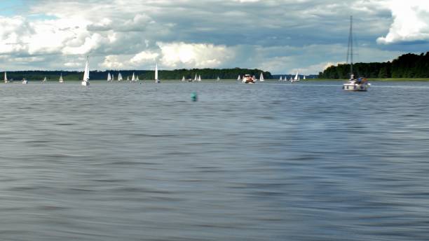 istock Sailing on Big Lake Passing by Yachts and Boats 1293572190
