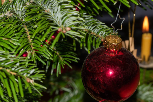 istock Christmas decorations and beeswax candles on the Christmas tree. 1293573168