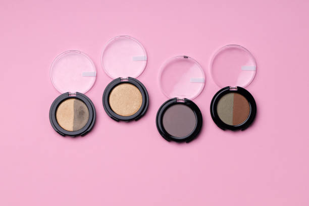 istock Set of eyeshadows make up products on pink 1293573954