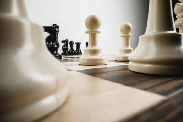 istock Macro photo of chess pieces on a chess board 1293574088