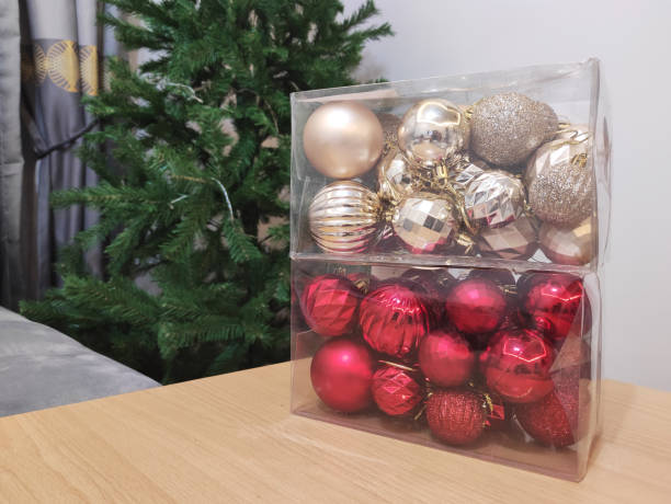 istock Packed christmas decorations with new year tree in the background 1293575177