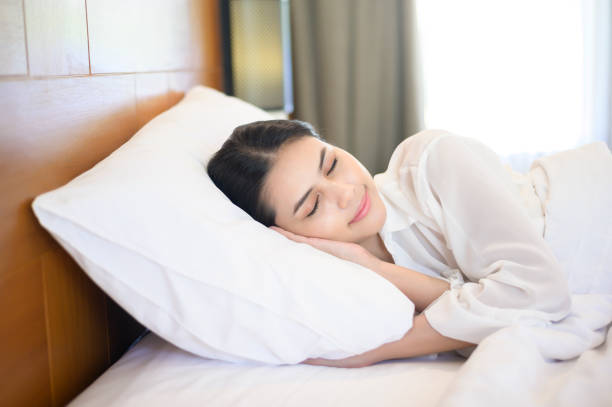 istock Young beautiful woman sleeping in her bed at home 1293579664