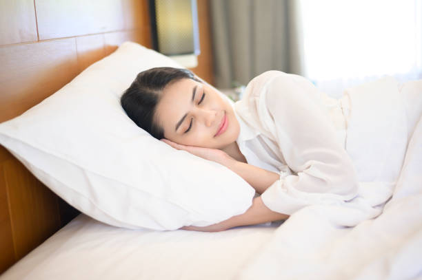 istock Young beautiful woman sleeping in her bed at home 1293579679