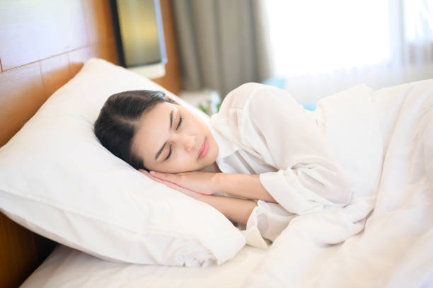 istock Young beautiful woman sleeping in her bed at home 1293579714