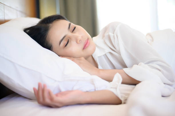 istock Young beautiful woman sleeping in her bed at home 1293579748