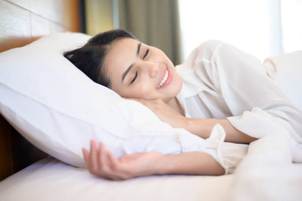 istock Young beautiful woman sleeping in her bed at home 1293579884
