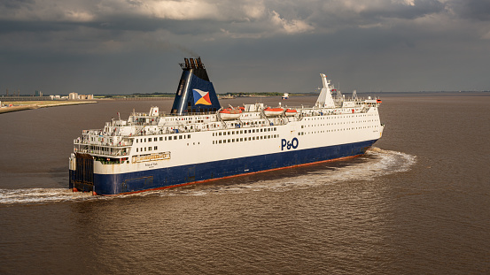 Kingston upon Hull, England, UK - May 22, 2019: A P&O ferry leaving the harbour and navigating on the River Humber