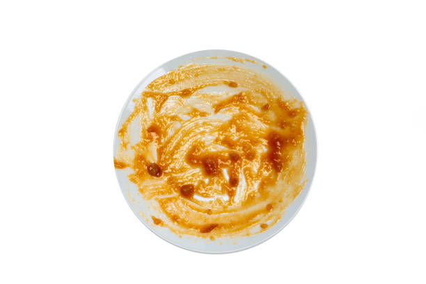 istock Empty white round ceramic and dirty dish after food with red sauce top view isolated on white background 1293581730