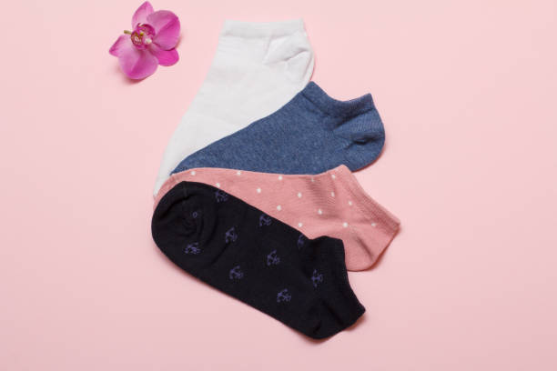 istock Women socks on pink background. Top view. 1293581810