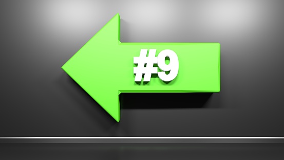 Green arrow to the left, with number 9 on black glossy wall - 3D rendering illustration
