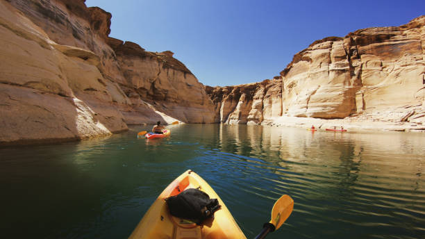 POV kayaking in canyons of Powell lake recreational area POV kayaking in canyons of Powell lake recreational area lake powell stock pictures, royalty-free photos & images