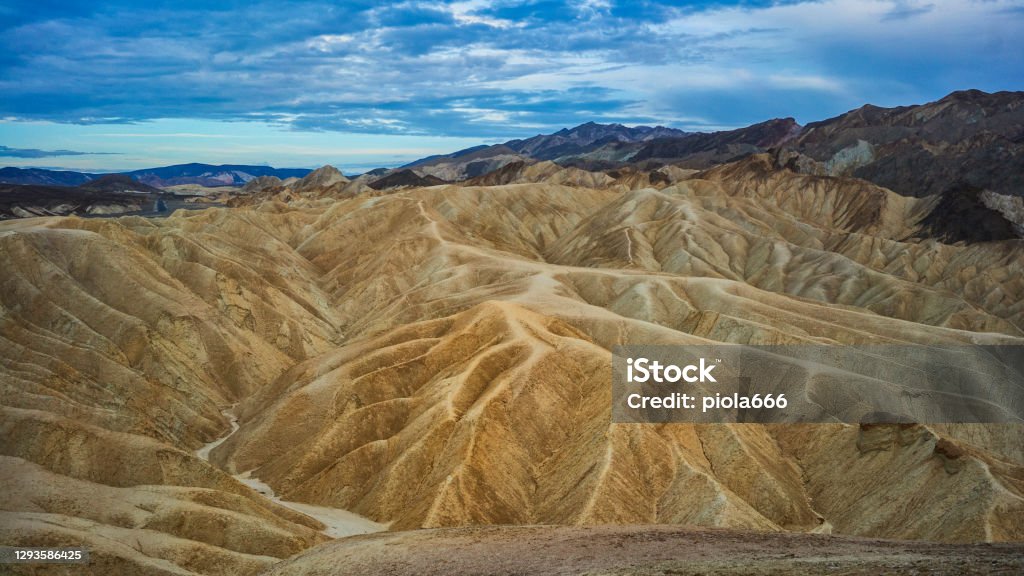 Summer vacations in California: dunes and sand at the Death Valley National Park, Zabriskie Point Abstract Stock Photo