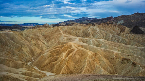 Summer vacations in California: dunes and sand at the Death Valley National Park, Zabriskie Point Summer vacations in California: dunes and sand at the Death Valley National Park, Zabriskie Point mojave desert stock pictures, royalty-free photos & images