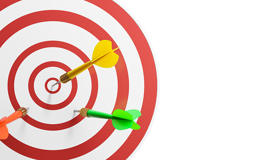 Close-Up of a Bull's Eye On a Wall with three Darts in the target on a white background. 3d illustration