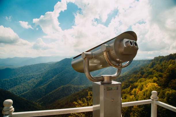 istock Binoculars with coins overlooking the Blue Mountains, Landscape with beautiful cloudy sky and mountains .. 1293587462