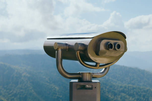istock Binoculars with coins overlooking the Blue Mountains, Landscape with beautiful cloudy sky and mountains .. 1293587498