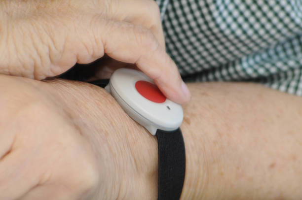 istock emergency button on wrist of an old woman 1293587523
