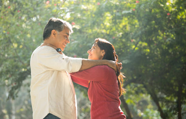 istock Romantic couple at park 1293588587