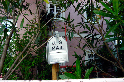 U.S. american mailbox in front of house, approved by the postmaster general
