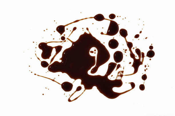 istock drops of black sauce on a white background. Abstract texture. 1293590569