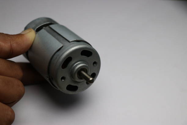 DC Motor also called by name 775 Motor used in cutter, electric drill and CNC Projects. Hand holding 12v DC Motor DC Motor also called by name 775 Motor used in cutter, electric drill and CNC Projects. Hand holding 12v DC Motor 12v stock pictures, royalty-free photos & images