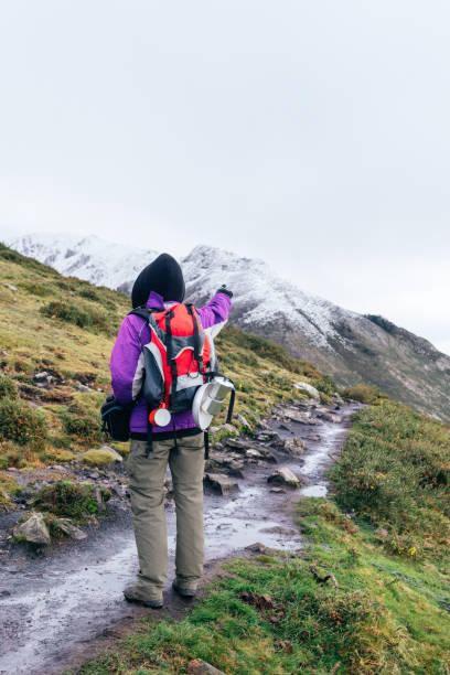 istock photographer and hiker on snowy mountain 1293595232
