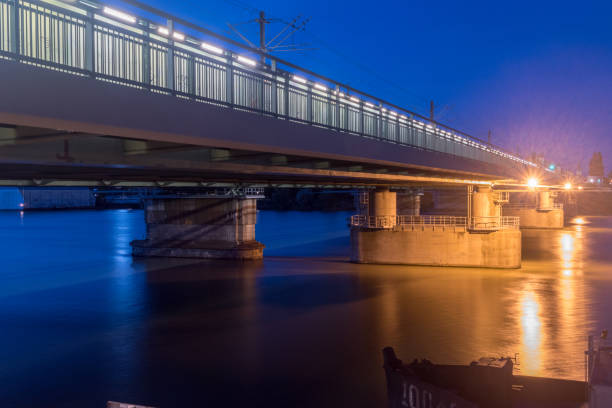 istock Bridge over Danube river at night in Vienna, Austria. 1293595625