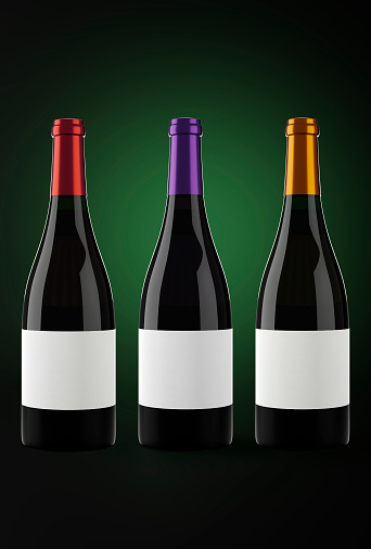 Three Bottles of red wine in a dark background