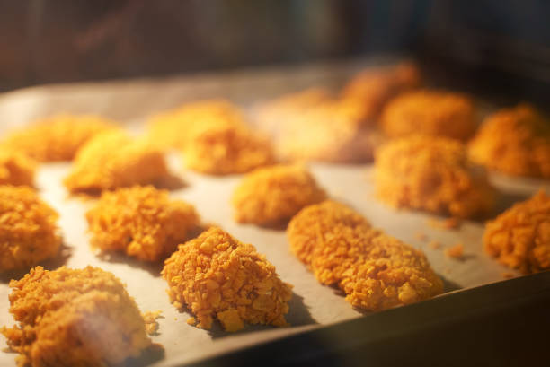 Chicken nuggets are baked in the oven