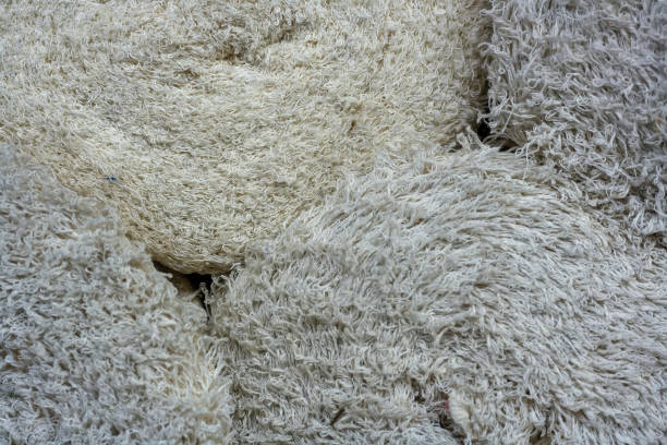 istock Rolls with rags close-up. Light textile material with a long pile. 1293602793
