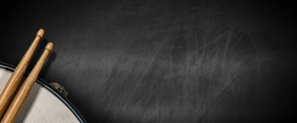 Drumsticks and Snare Drum on empty Blackboard - Percussion instrument