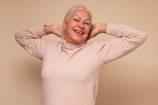 istock Excited senior woman raised stretched hands resting on weekend 1293606679