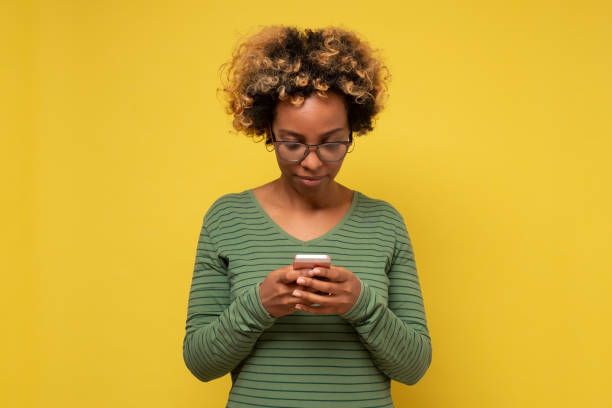 istock African woman holding in hands device chatting on web 1293609988