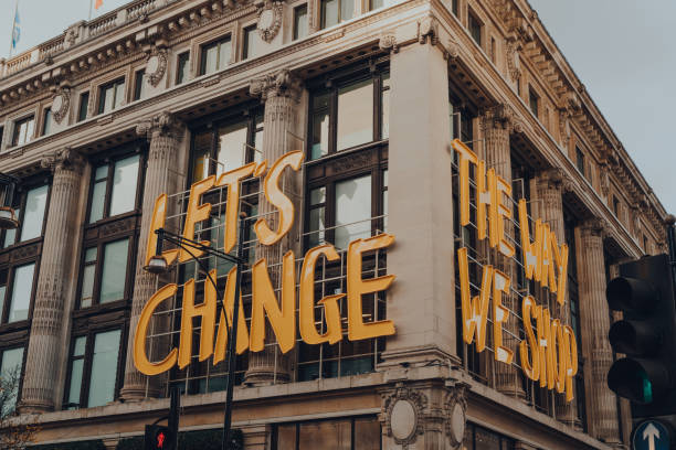 Lets Change The Way We Shop sign on the facade of Selfridges department store in Oxford Street, London, UK. London, UK - December 5,2020: Lets Change The Way We Shop sign on the facade of Selfridges department store in Oxford Street. It is part of a Project Earth to boost the sustainability of its products. inner london stock pictures, royalty-free photos & images