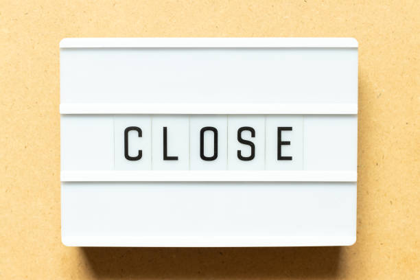 istock Lightbox with word close on wood background 1293613730