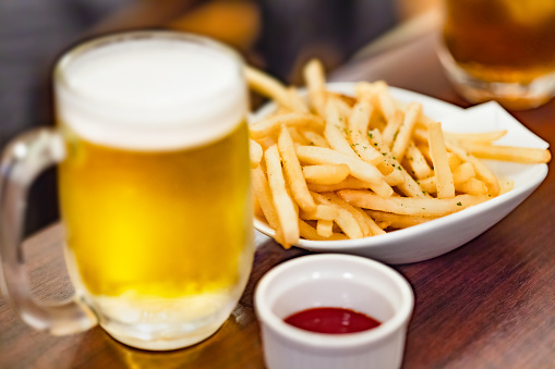 Beer and french fries at a drinking party
